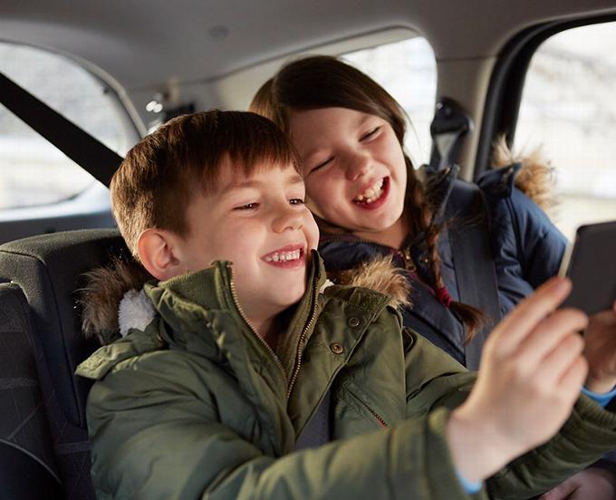 Boy and Girl in back of car